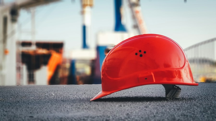 Hard hat resting on site pavement